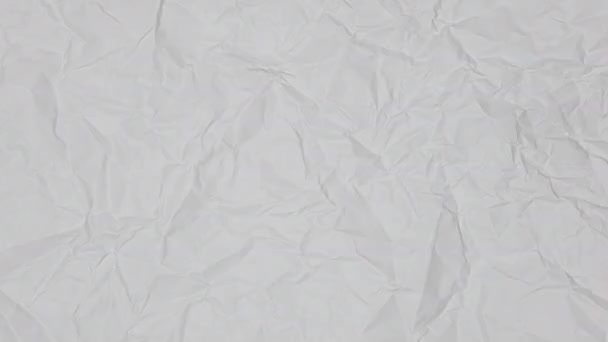 ビデオ 洗練された質感のある白または軽い灰色のペーパーのトップビュー 白い粉砕されたペーパー質の背景 洗練された抽象的な紙の背景 — ストック動画