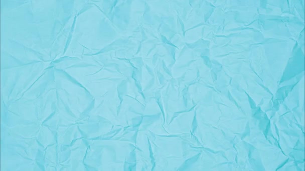 ライトブルーペーパーの動画トップビュー ブルーの粉砕されたペーパー質の背景 洗練された抽象的な紙の背景 — ストック動画