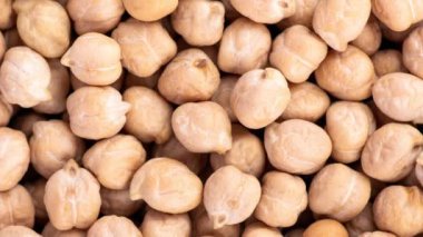 Nohut arkaplanının video arkaplanı. Sağlıklı vejetaryen gıda konsepti. Nohut ile en iyi görünüm pankartı.