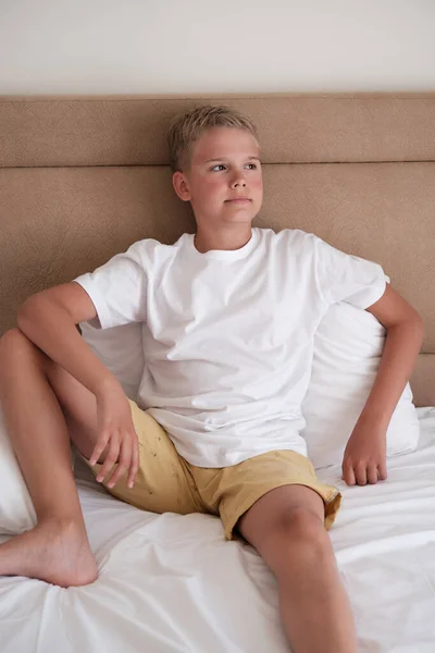 Cute Young Teenager Sits Bed White Shirt Looks Out Window — Foto Stock