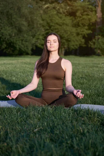 Young Woman Sits Lotus Position Meditates Park Warm Summer Day — Stock Fotó