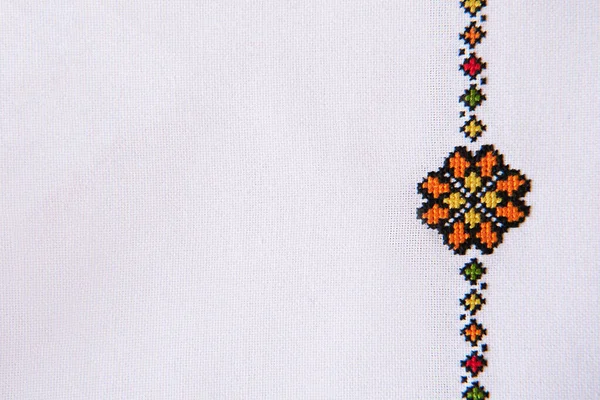 Folk Embroidery Design on White Linen. Background with Fabric Texture and Embroidered Ornament Element.