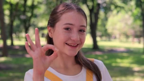 Funny Girl Freckles Yellow Sundress Shows Gesture Winks While Looking — Stock Video