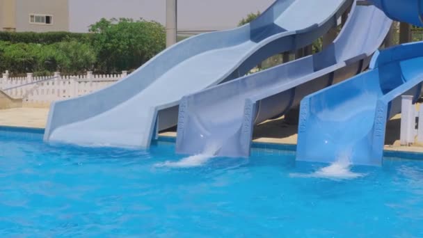 Empty Water Slides Awaiting Riders Sunlit Aquatic Park — Stock Video