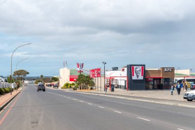 Bredasdorp, South Africa - Sep 23, 2022: A street scene, with business, people and vehicles, in Bredasdorp in the Western Cape Province