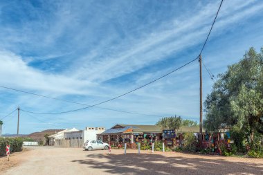 Van Wyksdorp, South Africa - Sep 24, 2022: A street scene, with the Van Wyksdorp Mall and a car, in Van Wyksdorp in the Western Cape Province