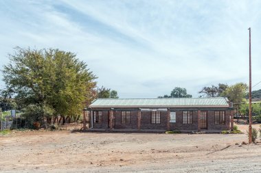 Van Wyksdorp, South Africa - Sep 24, 2022: A street scene, with the building of the Kannaland Municipality, in Van Wyksdorp in the Western Cape Province