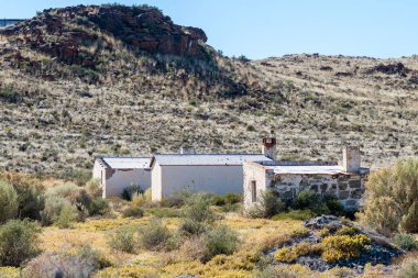 LOXTON, SOUTH AFRICA - SEP 3, 2022: Farm worker houses near Juriesfontein on the road R356 between Loxton and Fraserburg in the Northern Cape Karoo.