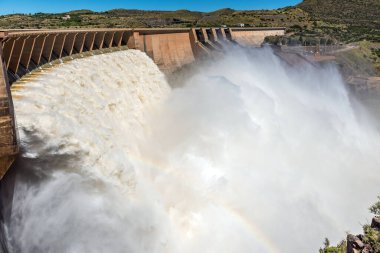 The second largest dam in South Africa, the Vanderkloof Dam, overflowing. It is in the Orange River on the border between the Free State and Northern Cape Provinces