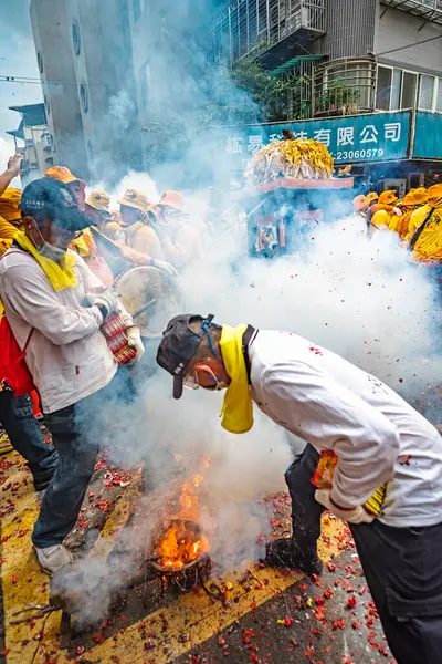 stock image Taipei, Taiwan - July 21,2024 : The li-pow in the temple fairli-pow refers to using a stove to heat the pig iron sheets of the plowshare at high temperature, then lighting the cannon in a streaking manner and throwing it under the mikoshi. 