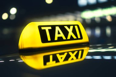 Selective focus on yellow taxi sign. Reflection in roof of car against neon lights of city street at night clipart