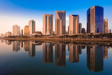 Modern Buildings Reflection in Pinheiros River in Sao Paulo City, Brazil clipart
