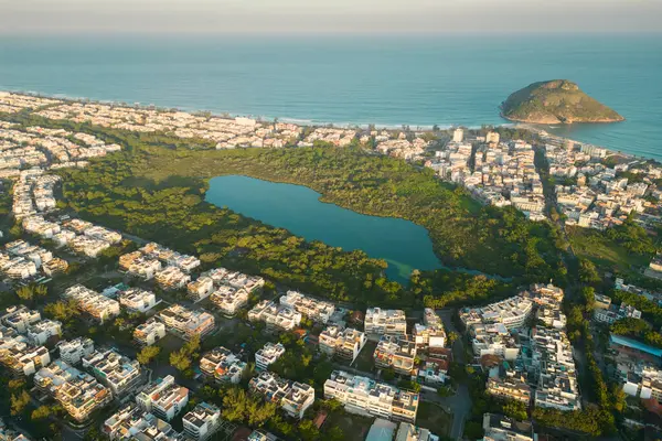 stock image Aerial View of Big Houses in Recreio dos Bandeirantes Neighborhood With Atlantic Ocean in the Horizon, Pedra do Pontal, Park With Small Lake, in Rio de Janeiro, Brazil