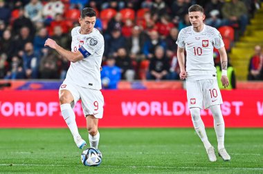 PRAGUE, CZECH REPUBLIC - MARCH 24, 2023: Qualifications for UEFA Euro 2024. Match Czech Republic - Poland 3:1. In action Robert Lewandowski (L) and Sebastian Szymanski (R). clipart