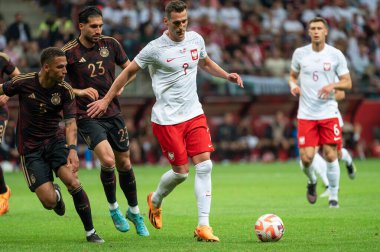 WARsaw, POLAND - 16 Haziran 2023 Polonya-Almanya maçı 1: 0. Eylemde Thilo Kehrer (5) Emre Can (23) Arkadiusz Milik (7)).