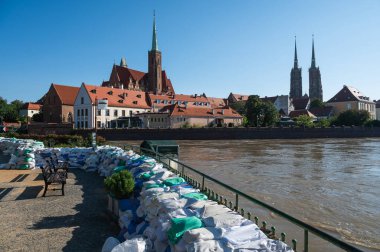 Reinforcement of river embankments with  sandbags, flood risk in Wroclaw, Poland clipart