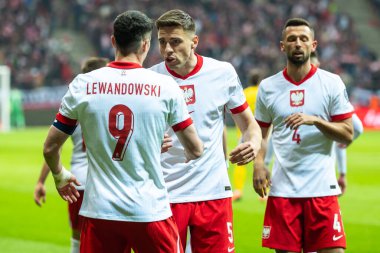 SAVAŞ, POLAND - 21 Mart 2025 FIFA 2026 elemeleri. Polonya - Litvanya 1: 0. Robert Lewandowski ve Jan Bednarek.