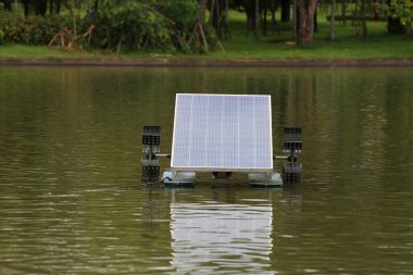 Water turbine powered by solar energy in the pond, Future technologies for power generation and energy savings. clipart