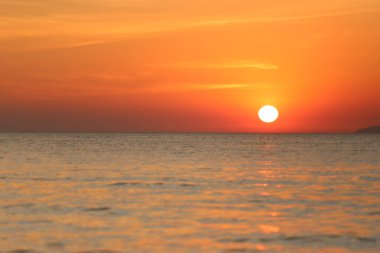 Sunset in the sea,Landscape of sea in the evening with bright sky and near twilight time.