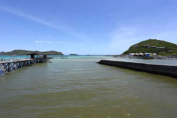 stock image A wooden bridge leads into the sea at a resort on a clear day at Samae San Bay in Chonburi Province in Thailand, which is ideal for a vacation.