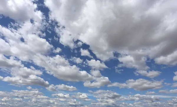 stock image Blue sky filled with white clouds on a clear day. can design to background.