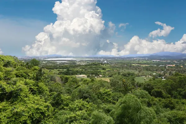 stock image Green forest view and looking at Nong Kho Reservoir, located in Sriracha District, Chonburi Province, with a background of sky and white clouds, on a clear day.