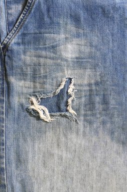 Mavi Denim arka planının eski dokusu. İş arkaplanı konseptinizde tasarım için dikey görüntü Blue Jeans vintage deseni.