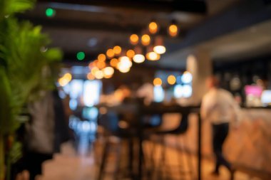 Bokeh ışıkları olan restoranın bulanık arka planı
