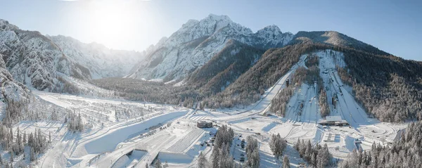 stock image Ski Jump in Planica near Kranjska Gora Slovenia covered in snow at winter time. Aerial Panorama