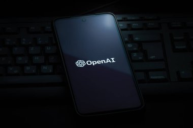 Ljubljana, Slovenia - 21 January 2023: OpenAI logo on smartphone screen laying on computer keyboard