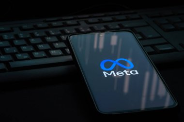 Ljubljana, Slovenia - 21 January 2023: Meta logo on smartphone screen laying on computer keyboard