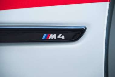 Slovenia, Ljubljana - 31 January 2023: BMW M4 high performance car detail with logo