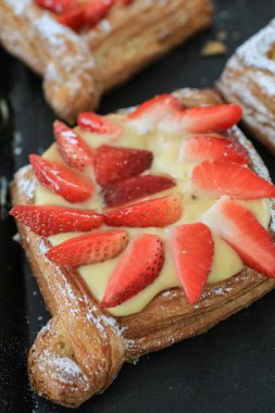 Danish dessert pastries with strawberry and custard cream. Fresh Bakery for morning  for breakfast.