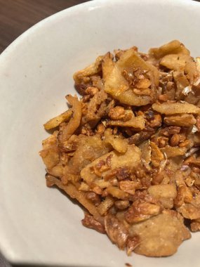 Garlic cracklings pork in white bowl. Good and delicious oil for health. Thai food concept.