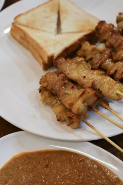 Pork Satay, Grilled pork served with peanut sauce or sweet and sour sauce. Thai street food that is delicious and popular among Thai people And tourists.