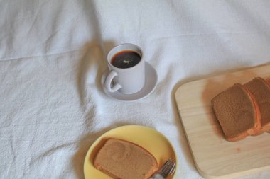 Hot coffee with butter bread on white background. Morning Breakfast concept. Minimal vintage tone. Top view flat lay with copy space for your text