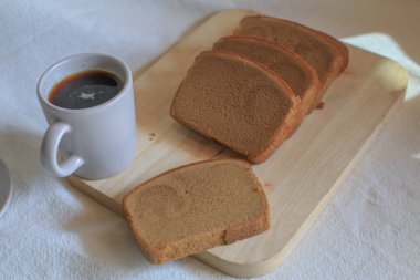 Hot coffee with butter bread on white background. Morning Breakfast concept. Minimal vintage tone. Top view flat lay with copy space for your text