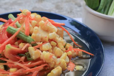 Thai spicy corn salad. Corn salad is adaptation menu from green papaya salad recipe (SOM TAM). Traditional Isan food in Thailand
