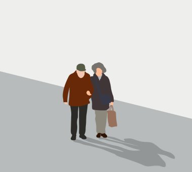 Senior Couple walking on city street with shopping bags in hands. Active elderly concept with mature man and woman having fun.