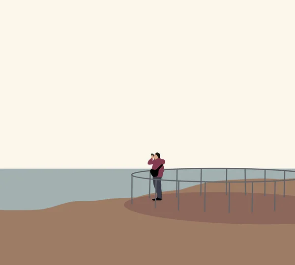 Seorang Pria Mengambil Gambar Pantai Sekitarnya Dengan Kamera Untuk Mempostingnya Stok Gambar