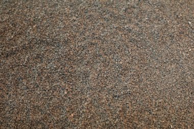 Kum toprak dokusu. Sert kumlu kahverengi yüzey. Tohum ekmeye elverişli verimli toprak.