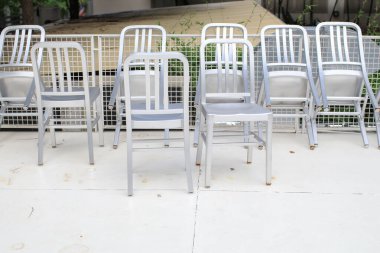 Iron Chairs closed cafe or restaurant indoor industrial and modern style. Empty with nobody using the area. Loft style interior.