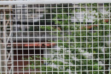 Izgara pas dokusu arka planı. Dekorasyon endüstrisi tarzı. Arkaplan ve duvar kağıdı için ağ dokusu deseni.