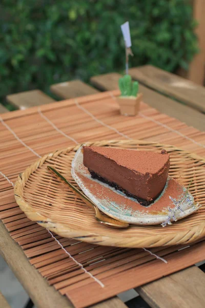 Dark chocolate fudge cake with cocoa powder. Homemade bakery. Birthday cake or valentine dessert. Home baking concept.