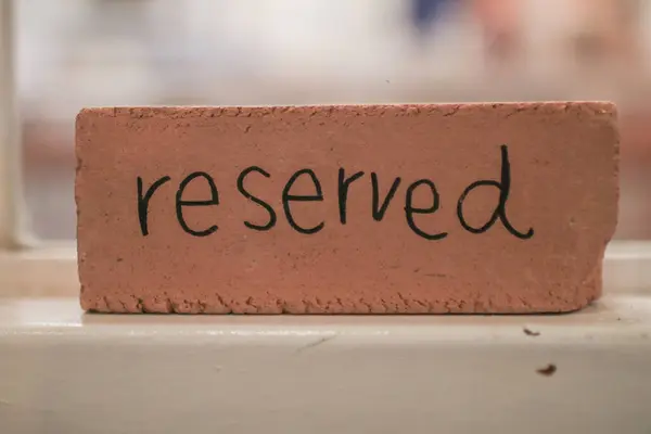 Restaurant reserved table sign. Restaurant reservation service. Cozy Interior of trendy cafe, modern dining place,