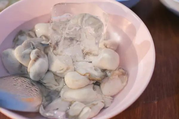 stock image Oysters dishes in Thai style with spicy dipping sauce and vegetable. Seafood cuisine style in restaurant near beach .