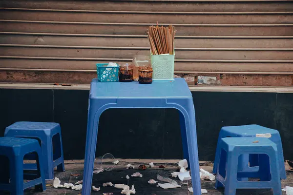 Stock image empty paper cup and tea pot on wooden table