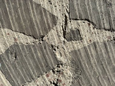 Beton ve tuff 'tan yapılmış gri ve beyaz ışıktan oluşan dairesel kesikli bir duvarın arka planı. Yüksek kalite fotoğraf