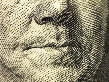 100 dolarlık banknot ve Benjamin Franklin 'in yüzü makro pozu. Benjamin Franklin 'in 100 dolarlık portresini yakın plan çek. Yüksek kalite fotoğraf