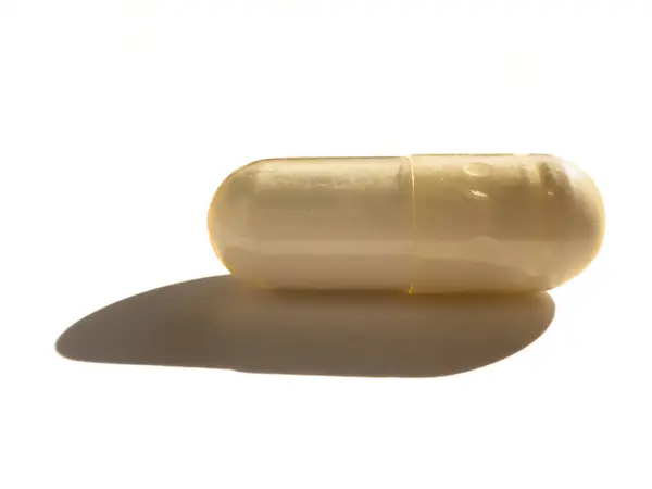 Beyaz arka planda gölgelendirilmiş beyaz haplar, kopyalama alanı!